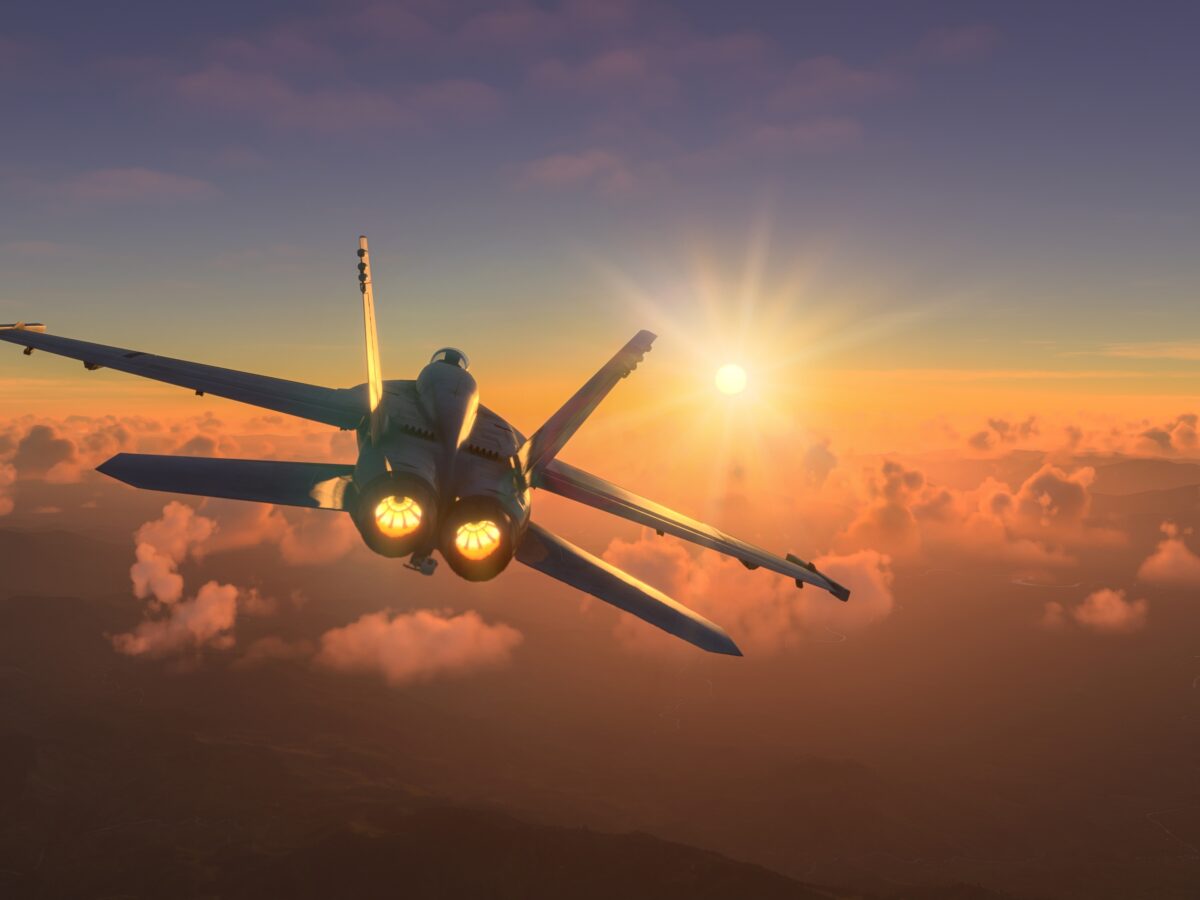 Militar,Aircraft,Flying,Over,The,Clouds,In,Amazing,Sunset